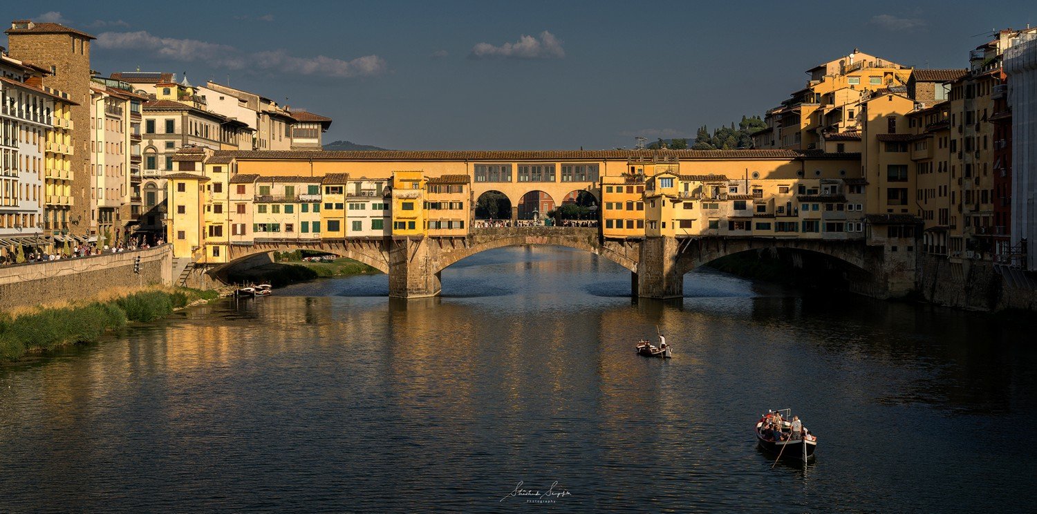 ponte vecchio bridge on arno river in florence tuscany italy shot during summer