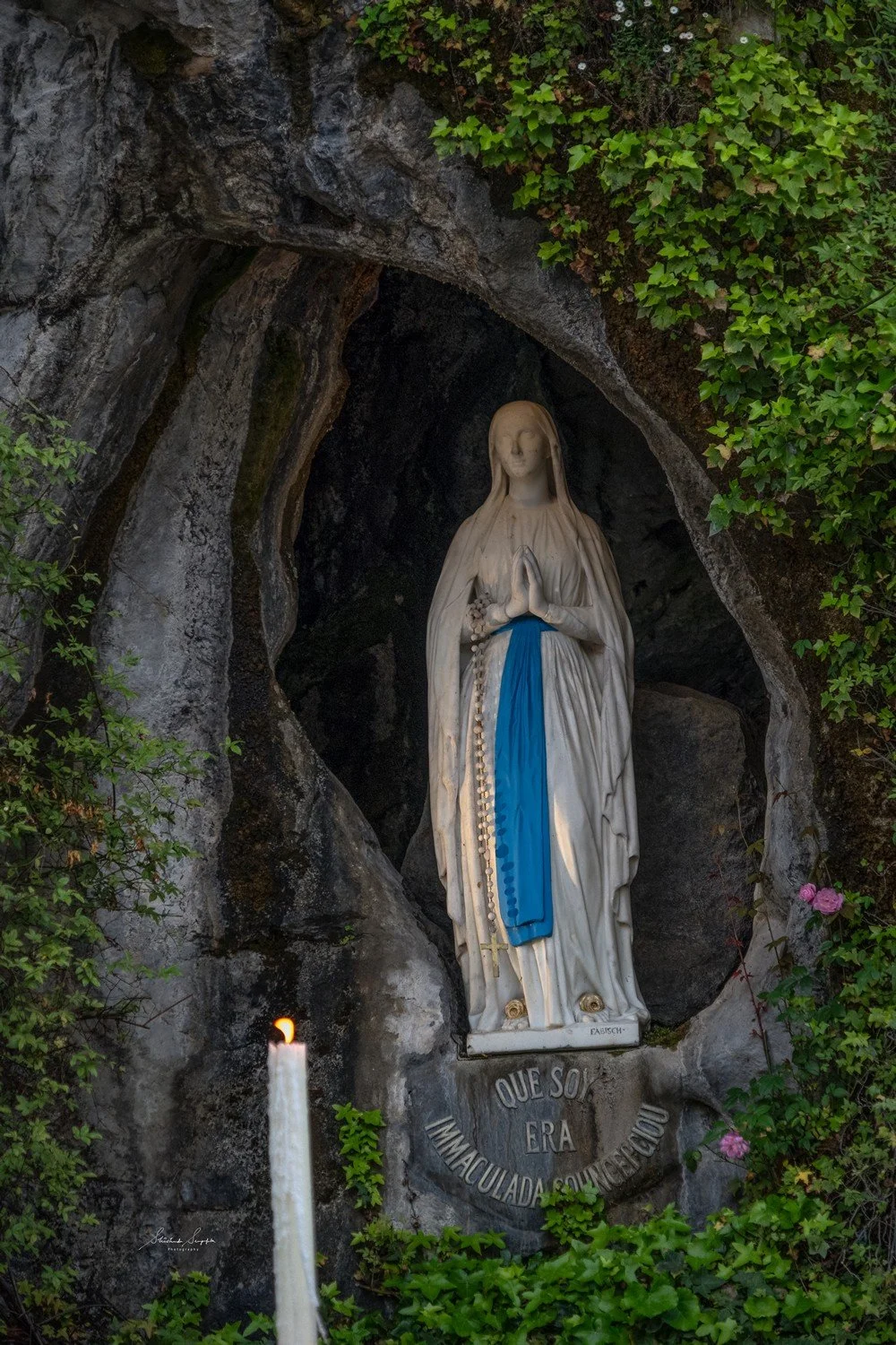 pilgrimage in the city of lourdes france dedicated to Lady Virgin Mary also known as Immaculate Conception who gave apparition to St. Bernadette featuring sanctuary church basilica grotto cave miraculous water and Marian procession