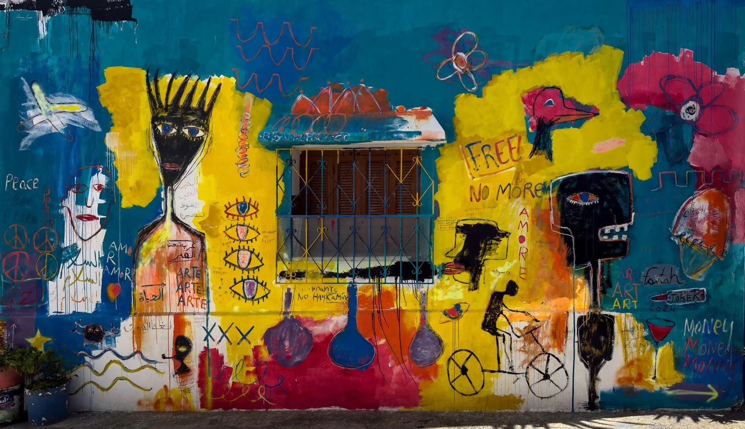 asilah in morocco africa featuring blue medina with painted doors windows street art graffiti mural krikia viewpoint raissouni palace alqamra tower and Grand Mosque