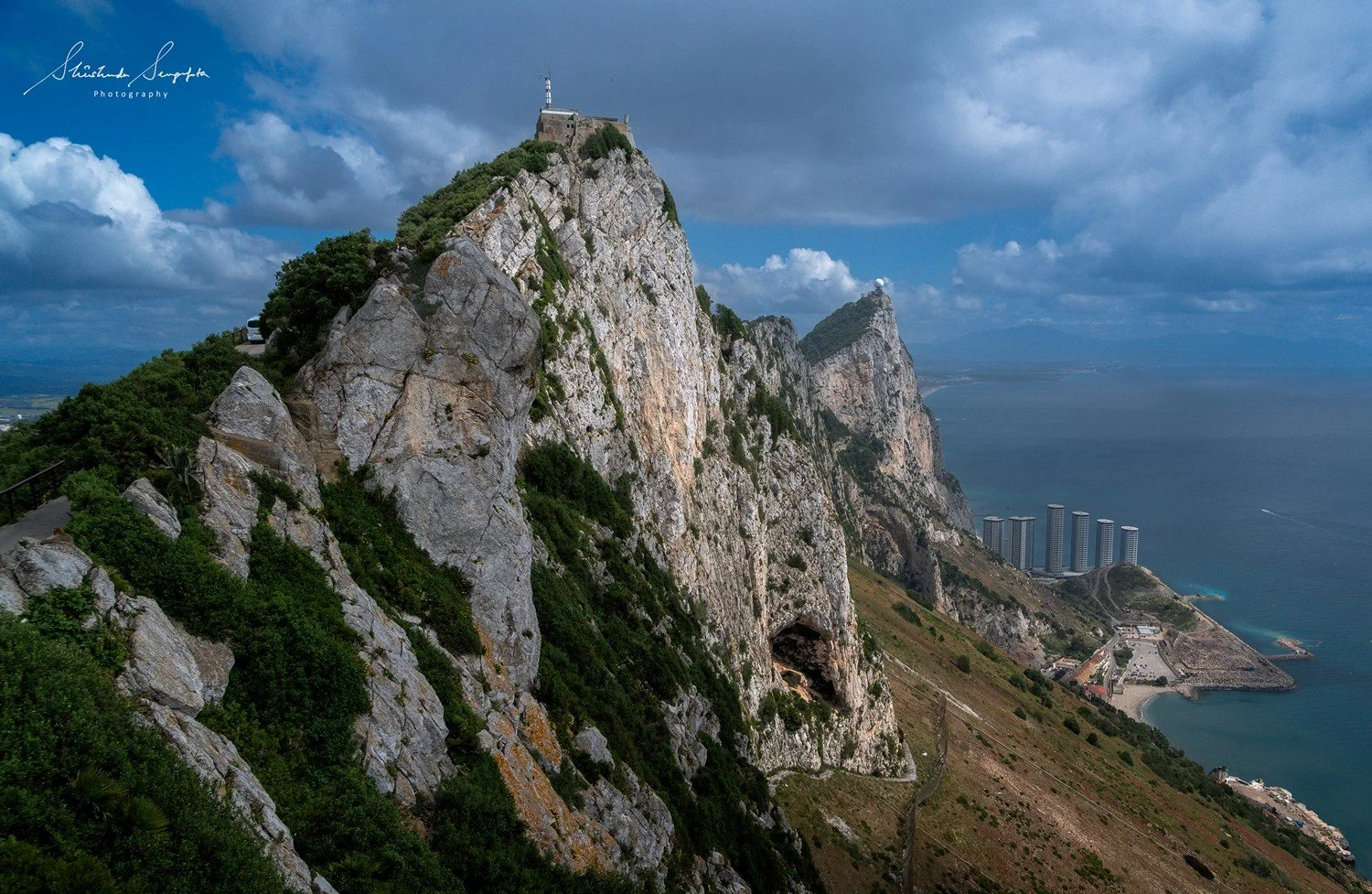 skywalk at gibraltar british overseas territory comprising upper rock housing  hercules pillars macaque monkeys caves tunnels and lower city colonial architecture churches lively squares bustling streets