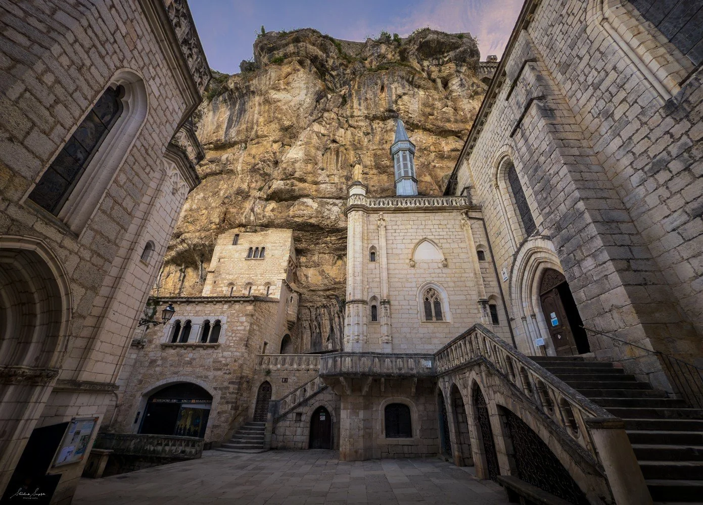 pilgrimage to sanctuary of rocamadour france which is a clifftop medieval village featuring castle chapel of notre dame housing black virgin crypt basilica and tomb of saint amadour