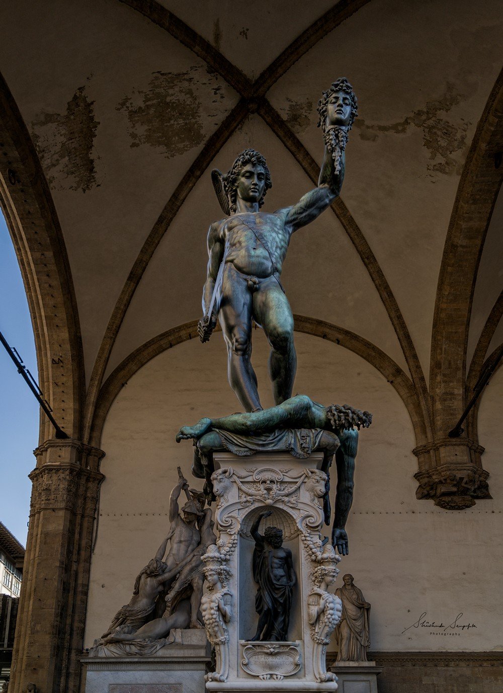 perseus holding the head of medusa in loggia del lanzi near palazzo vecchio town hall situated on piazza del signoria in florence tuscany italy shot during summer