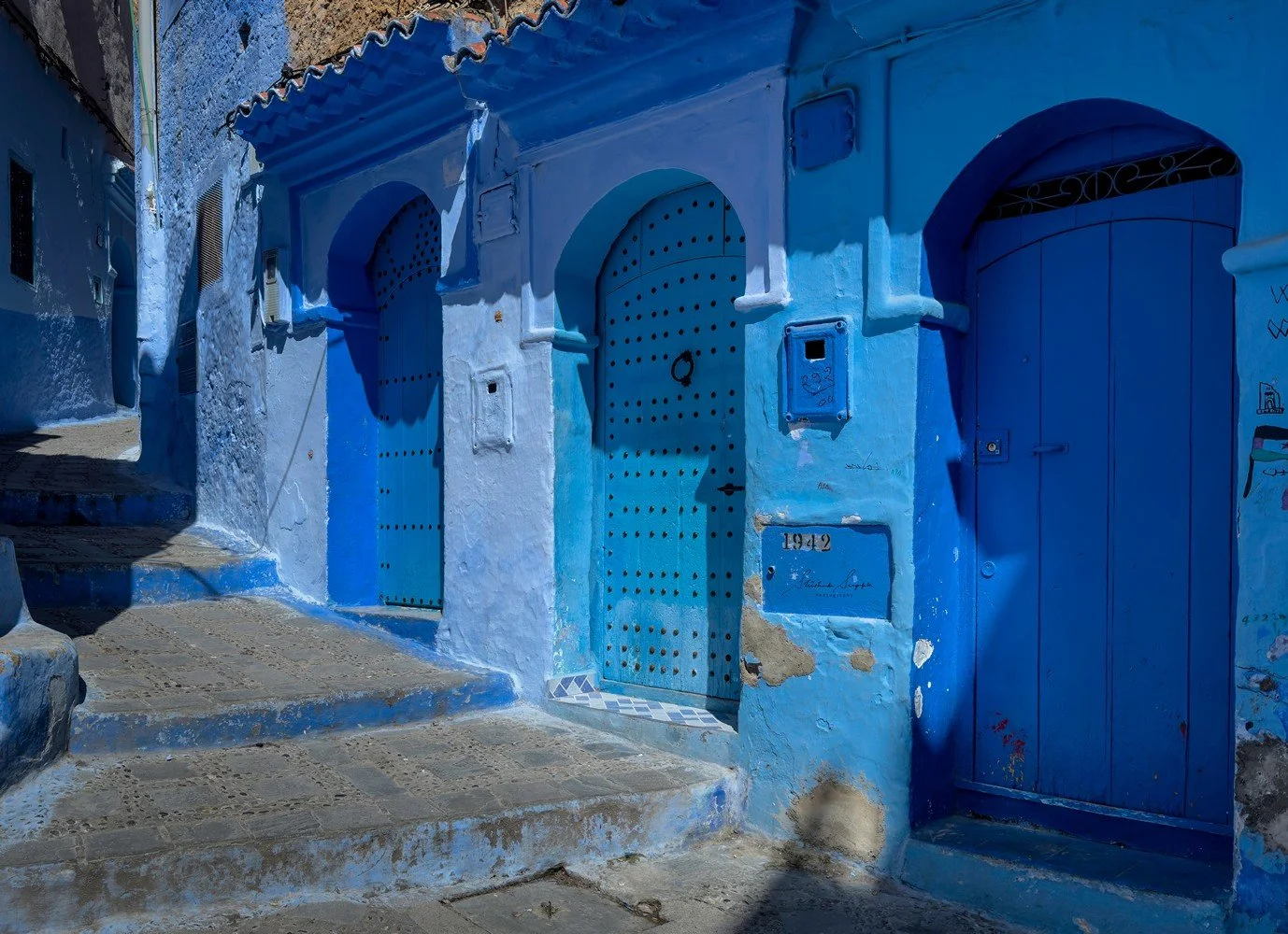 blue city of chefchaouen in morocco africa featuring blue medina alleyways place El Haouta plaza uta el hammam kasbah museum and sunset shot from bouzafer or spanish mosque