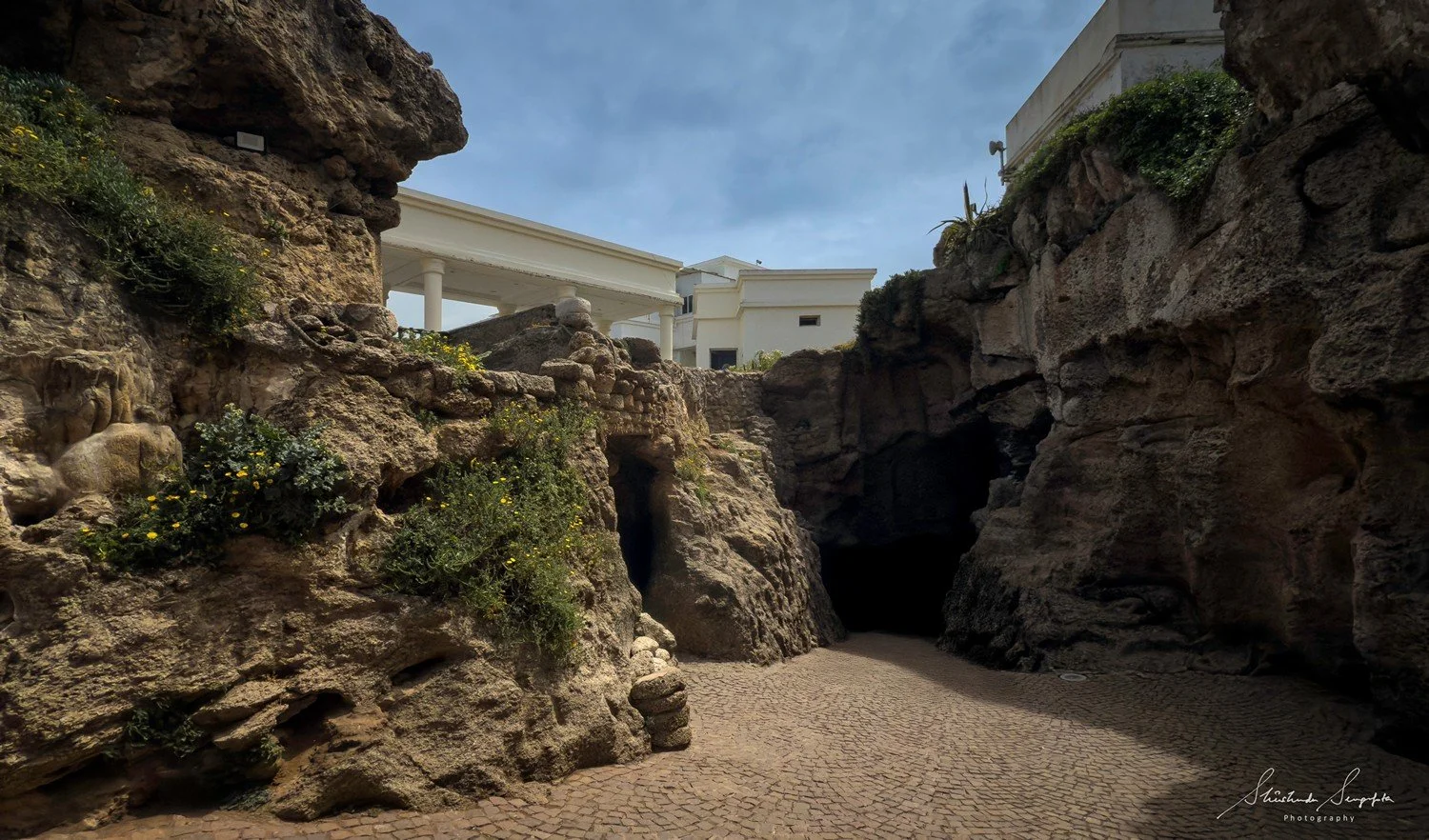 hercules caves in morocco africa featuring statues sculptures potteries and a view of the sea