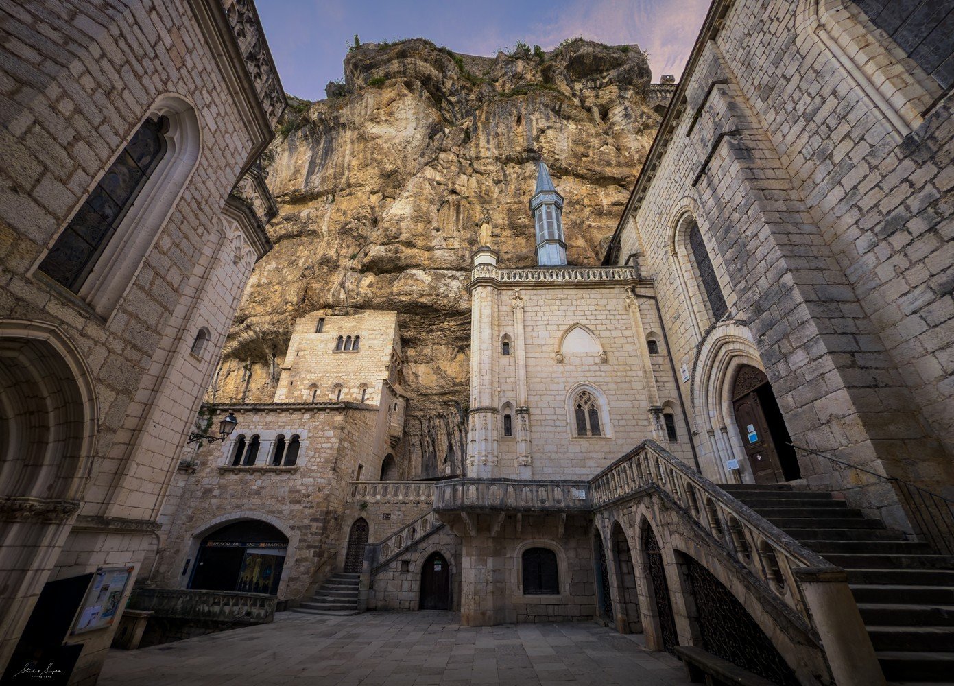pilgrimage to sanctuary of rocamadour france which is a clifftop medieval village featuring castle chapel of notre dame housing black virgin crypt basilica and tomb of saint amadour