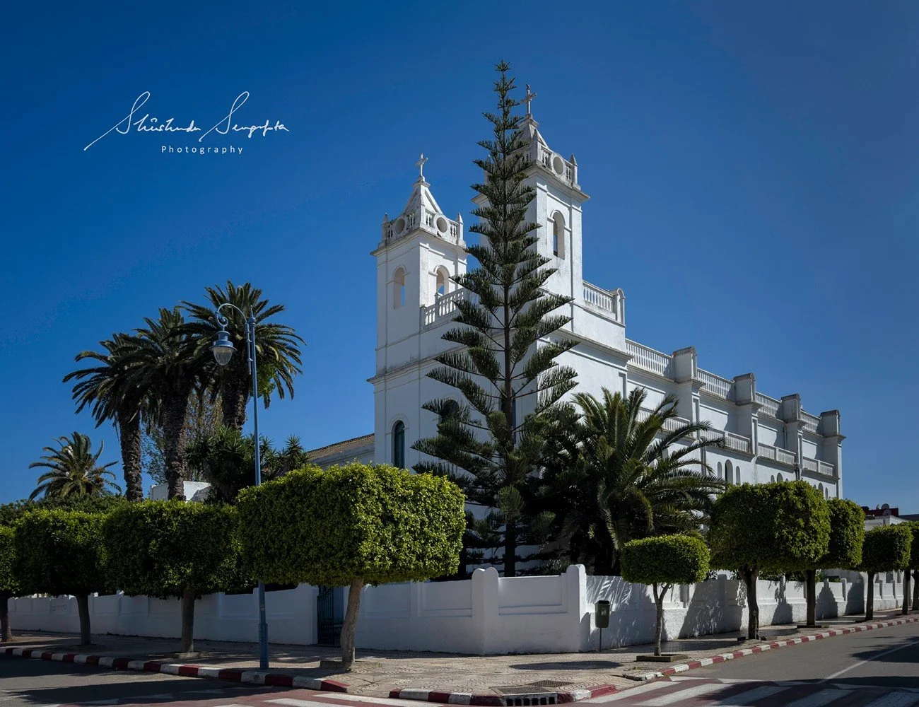 asilah in morocco africa featuring blue medina with painted doors windows street art graffiti mural krikia viewpoint raissouni palace alqamra tower and Grand Mosque