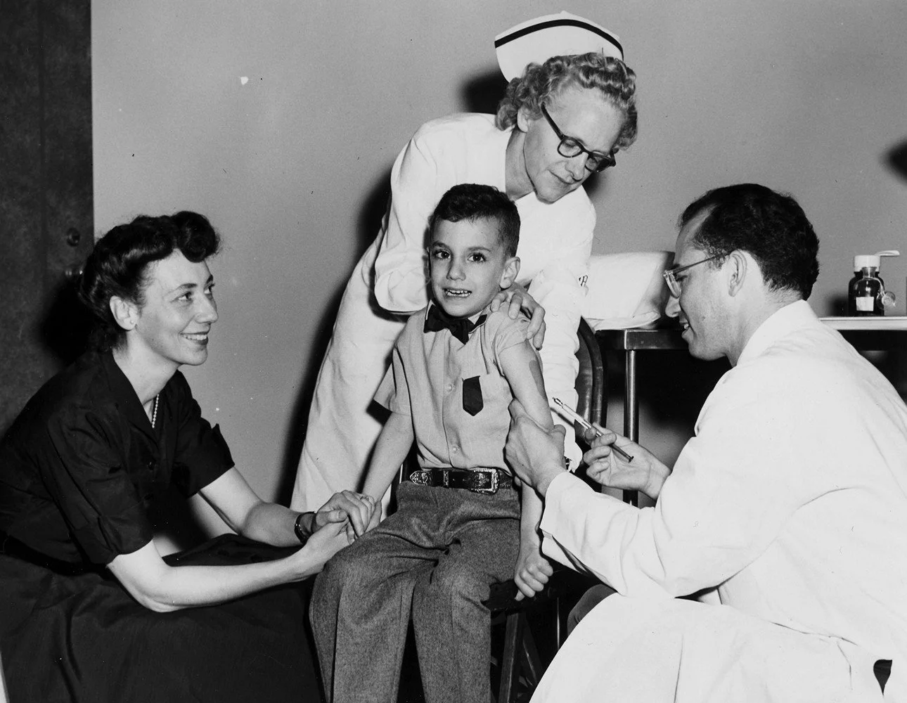 Dr. Jonas Salk vaccinates his son, Darrell, with the polio vaccine in 1954
