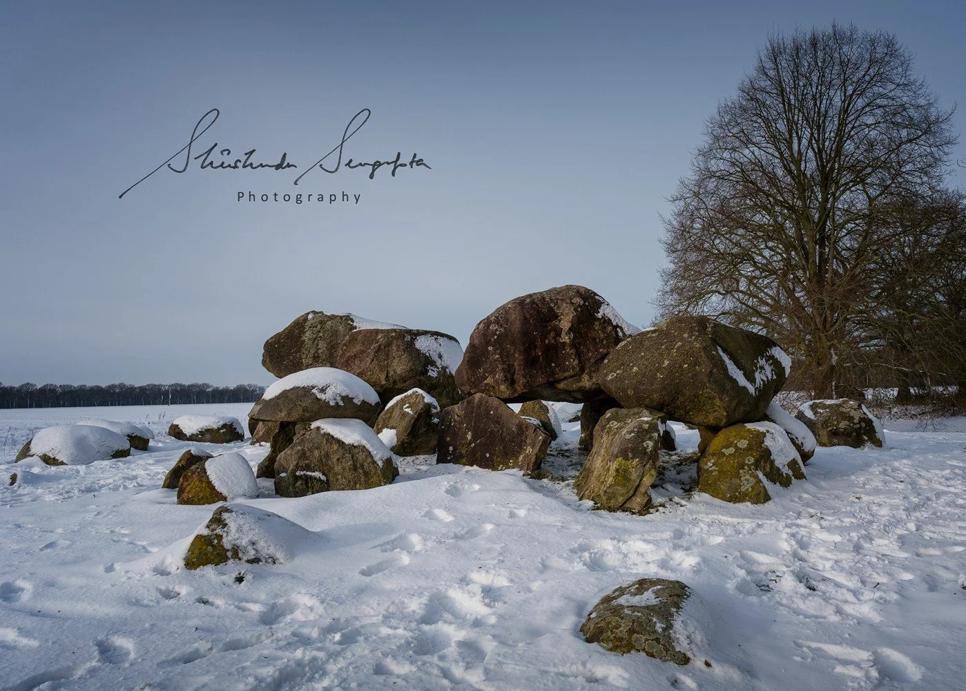 snow at d15 hunebed dolmen stonehenge in drenthe netherlands holland shot during sunset golden hour