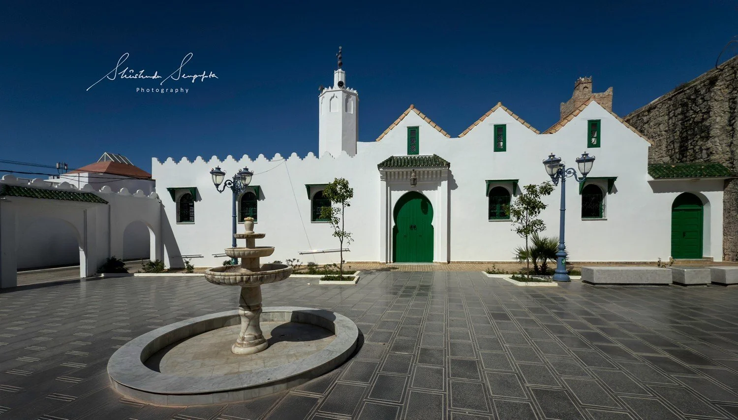 asilah in morocco africa featuring blue medina with painted doors windows street art graffiti mural krikia viewpoint raissouni palace alqamra tower and Grand Mosque