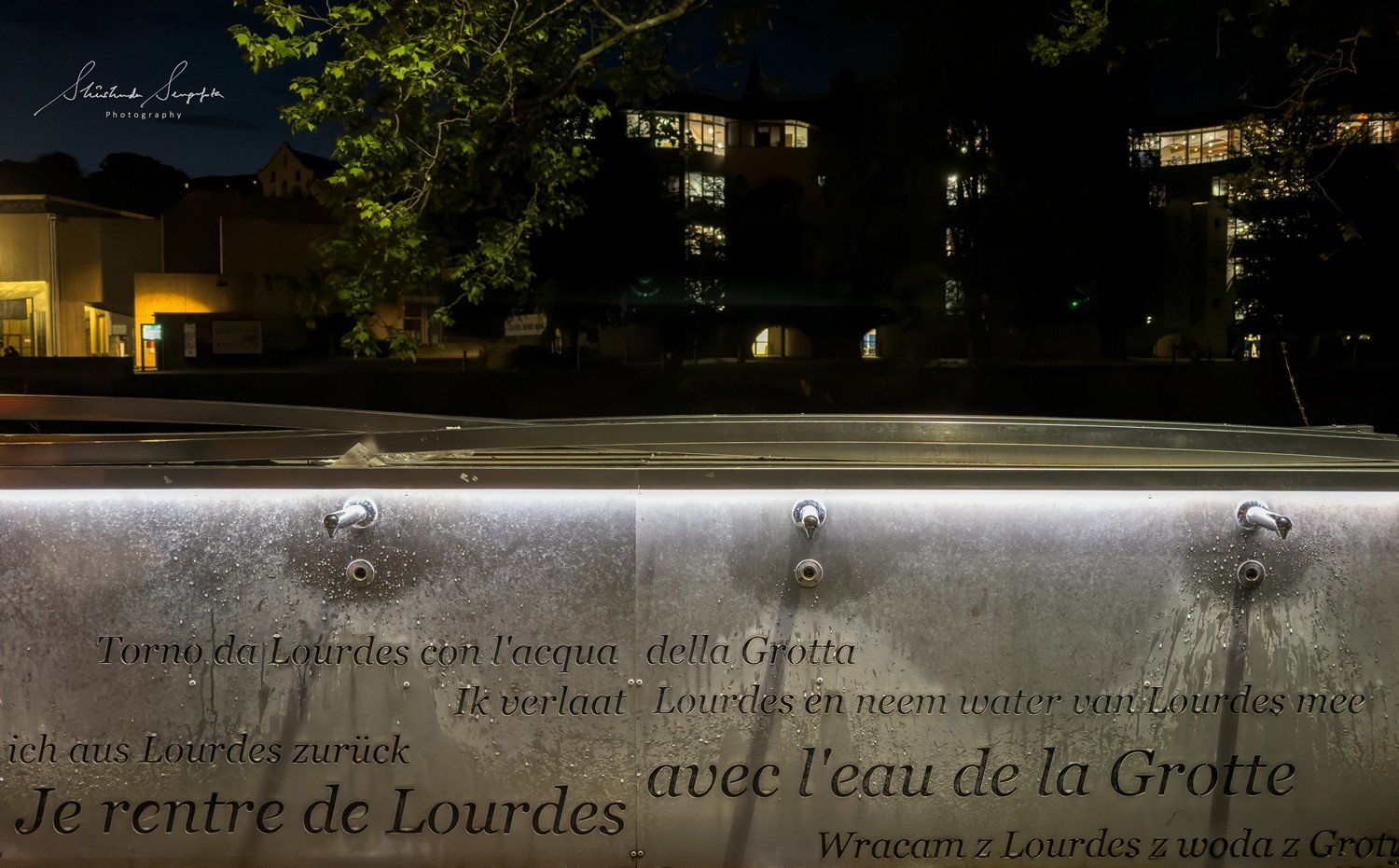 pilgrimage in the city of lourdes france dedicated to Lady Virgin Mary also known as Immaculate Conception who gave apparition to St. Bernadette featuring sanctuary church basilica grotto cave miraculous water and Marian procession