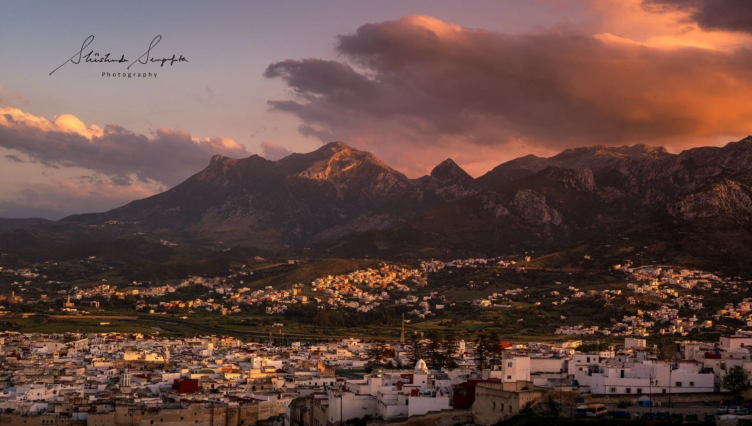 tetouan in morocco africa featuring blue and white palaces museums medina with houses doors windows city gate bab al okla dar el sanaa and oddi madrasa loukach white dove paloma blanca statue and panoramic viewpoint feddan park