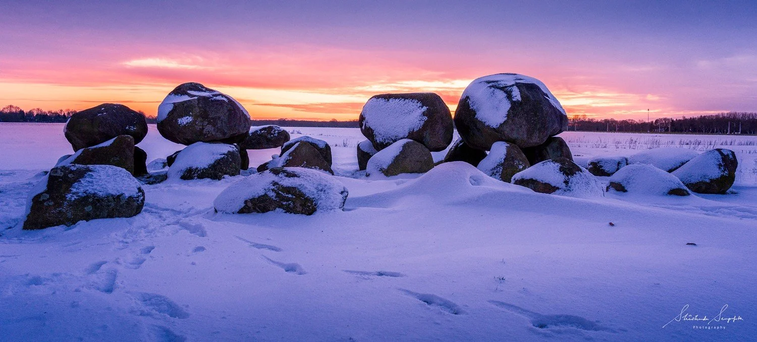 snow at dolmen hunebedden 15 drenthe netherlands at sunset