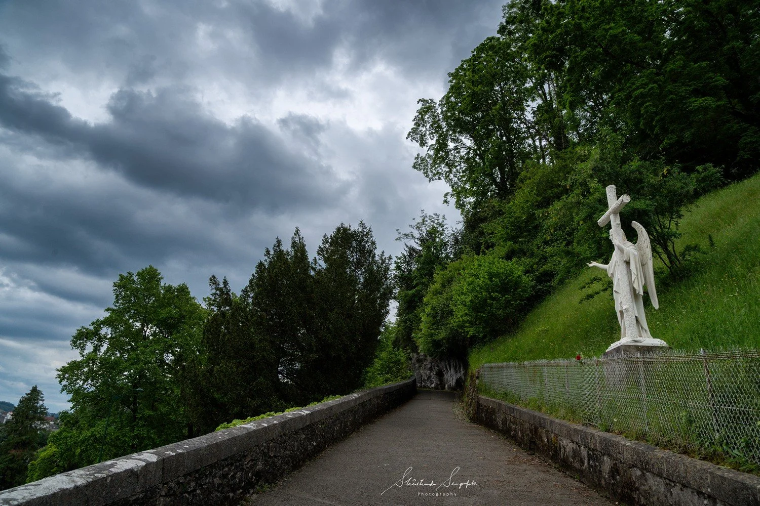 pilgrimage in the city of lourdes france dedicated to Lady Virgin Mary also known as Immaculate Conception who gave apparition to St. Bernadette featuring sanctuary church basilica grotto cave miraculous water and Marian procession
