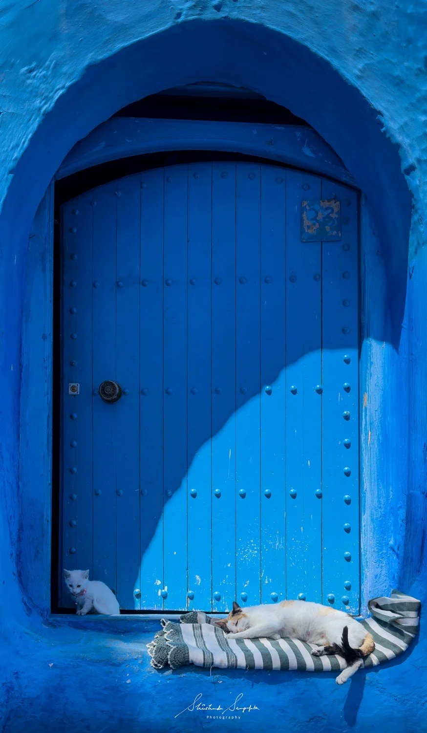 blue city of chefchaouen in morocco africa featuring blue medina alleyways place El Haouta plaza uta el hammam kasbah museum and sunset shot from bouzafer or spanish mosque