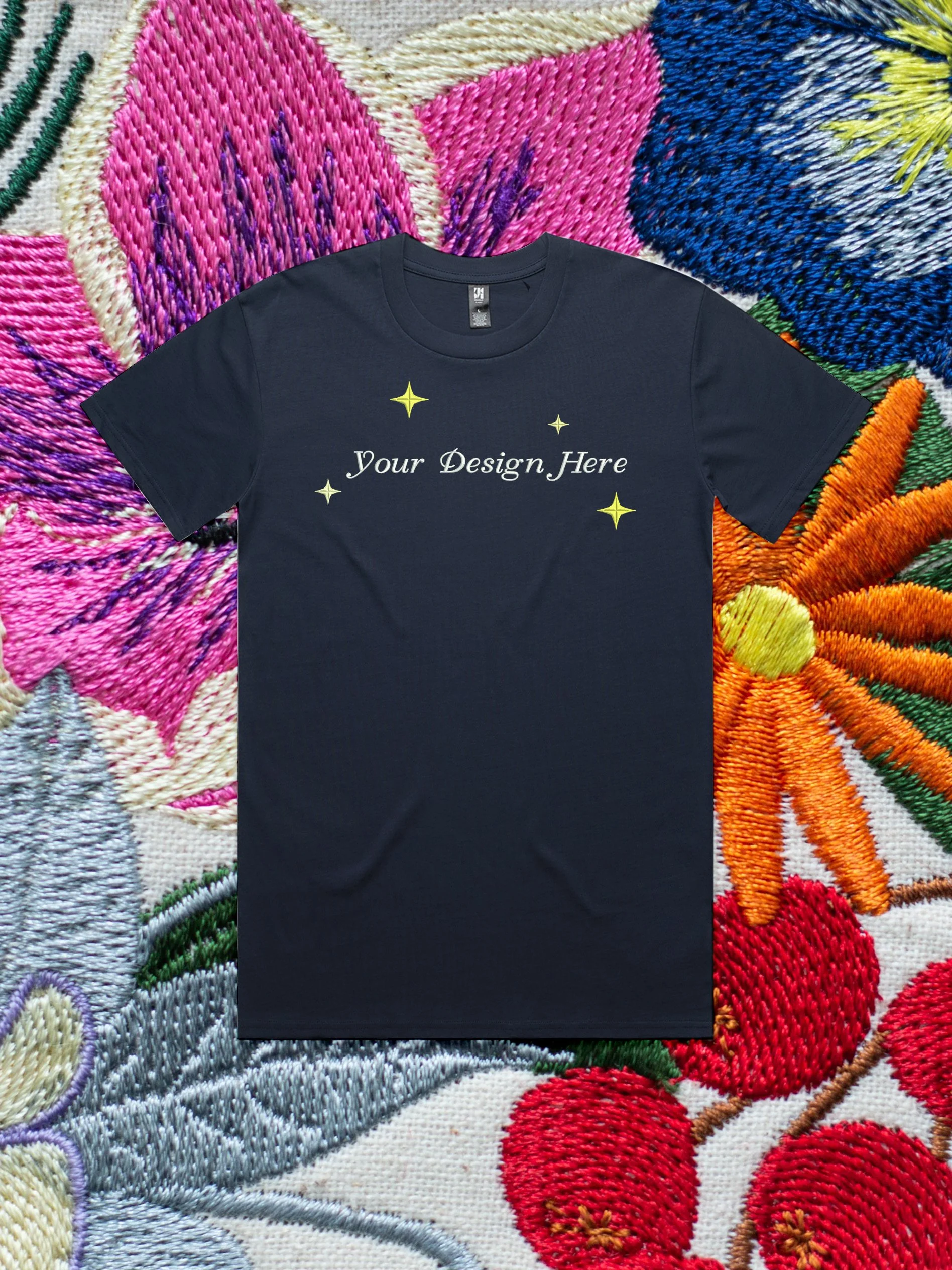 Custom Embroidery on a t-shirt against an embroidered floral background.