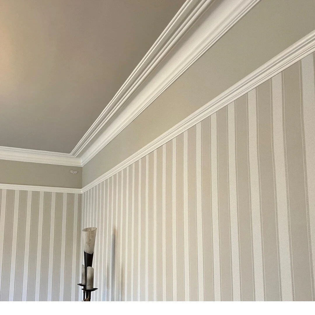 This customer loves traditional design, wallpaper and stripes so when she asked me to update her hall and living room with new paint and paper she didn't want me to stray too far from her existing style. I chose neutrals with soft green tones contras