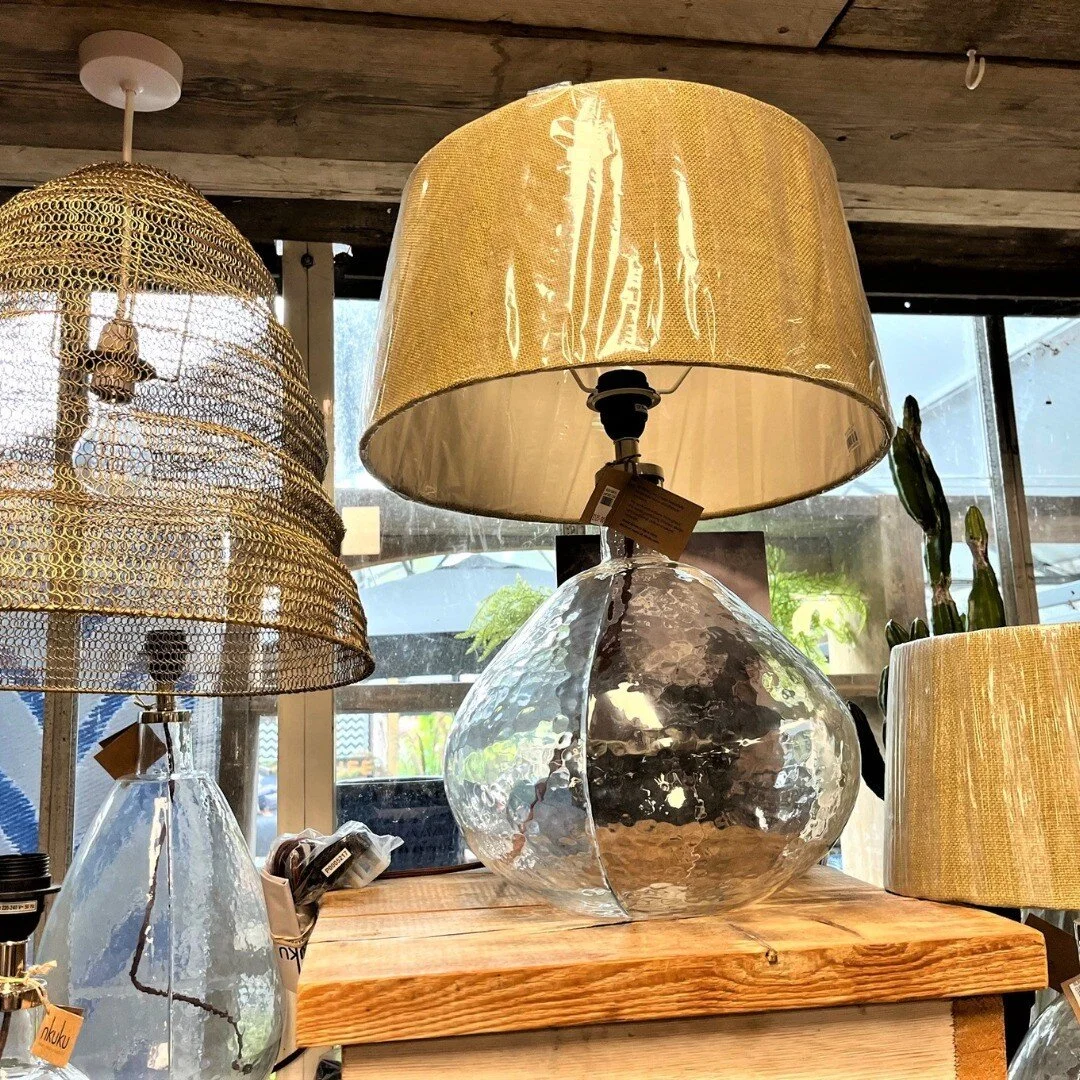 I was looking for decorative accessories and lighting at a local garden centre and I found these lovely lights from Nkuku. There are different shaped and coloured glass bases contrasting nicely with these natural shades. They would work well in an in
