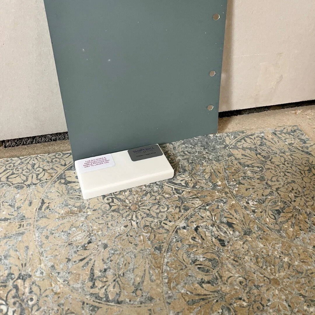 I get lots of requests to source bathroom tiles and find vanity unit colours and work tops that co-ordinate. I picked this distressed antique distressed floor tile for my client's Edwardian house. I then chose this rich dark blue/green for the vanity