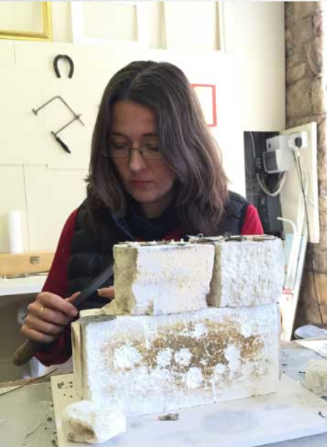Jeweller Cath Hill working with metal at her jewellery bench