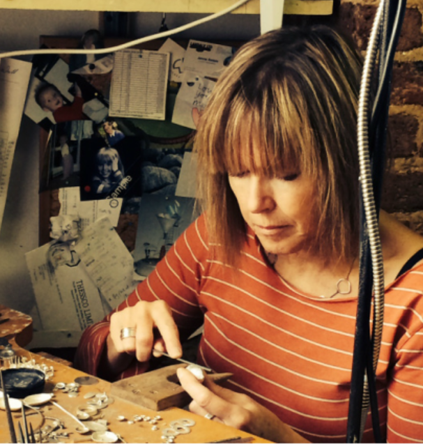 Jeweller Jenifer Wall working at her jewellery bench in Hove