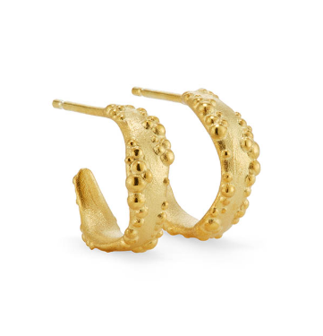 Golden hoop earrings with textured design.