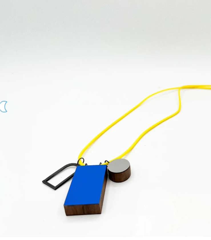 Geometric blue mixed material pendant necklace by contemporary jeweller Rachel Butlin