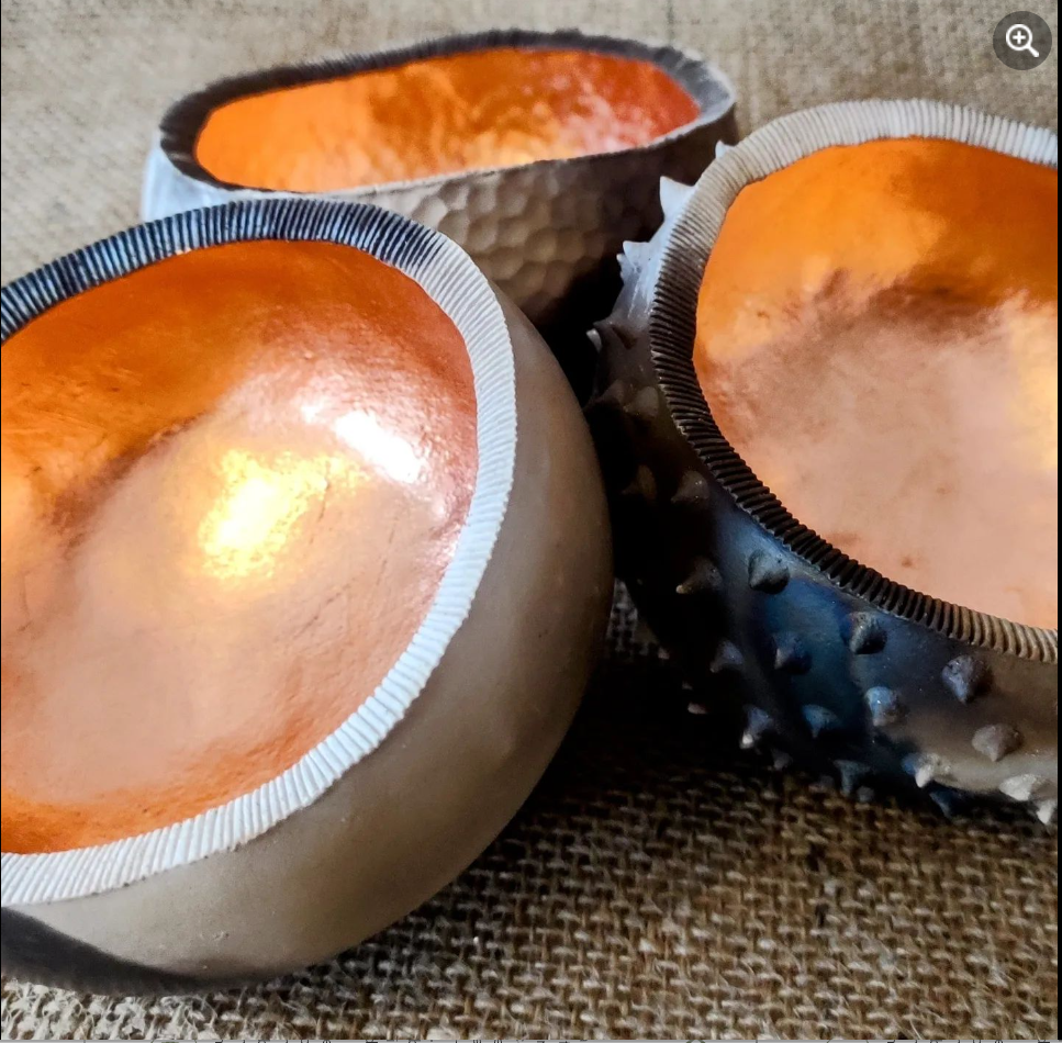 Handmade ceramic vessels with textured surfaces and copper leaf by Katie Pruden