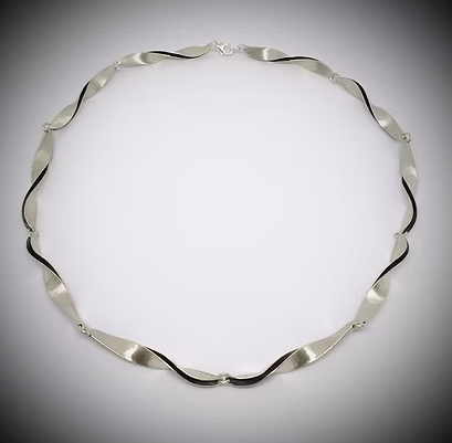 Handmade sculptural recycled silver necklace by Yelland and Barker