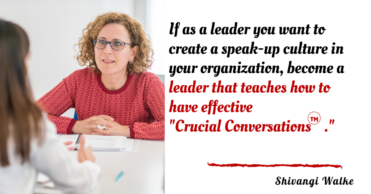 A woman with curly hair, glasses, and a red sweater sitting at a table engaging in a conversation with a person whose back is to the camera. The right side of the image contains a quote about leadership and effective conversations by Shivangi Walke.