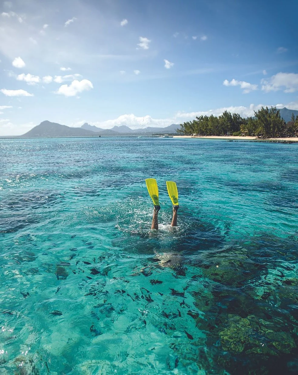 Snorkling i krystallklart vann på Mauritius etter safari i Sør-Afrika