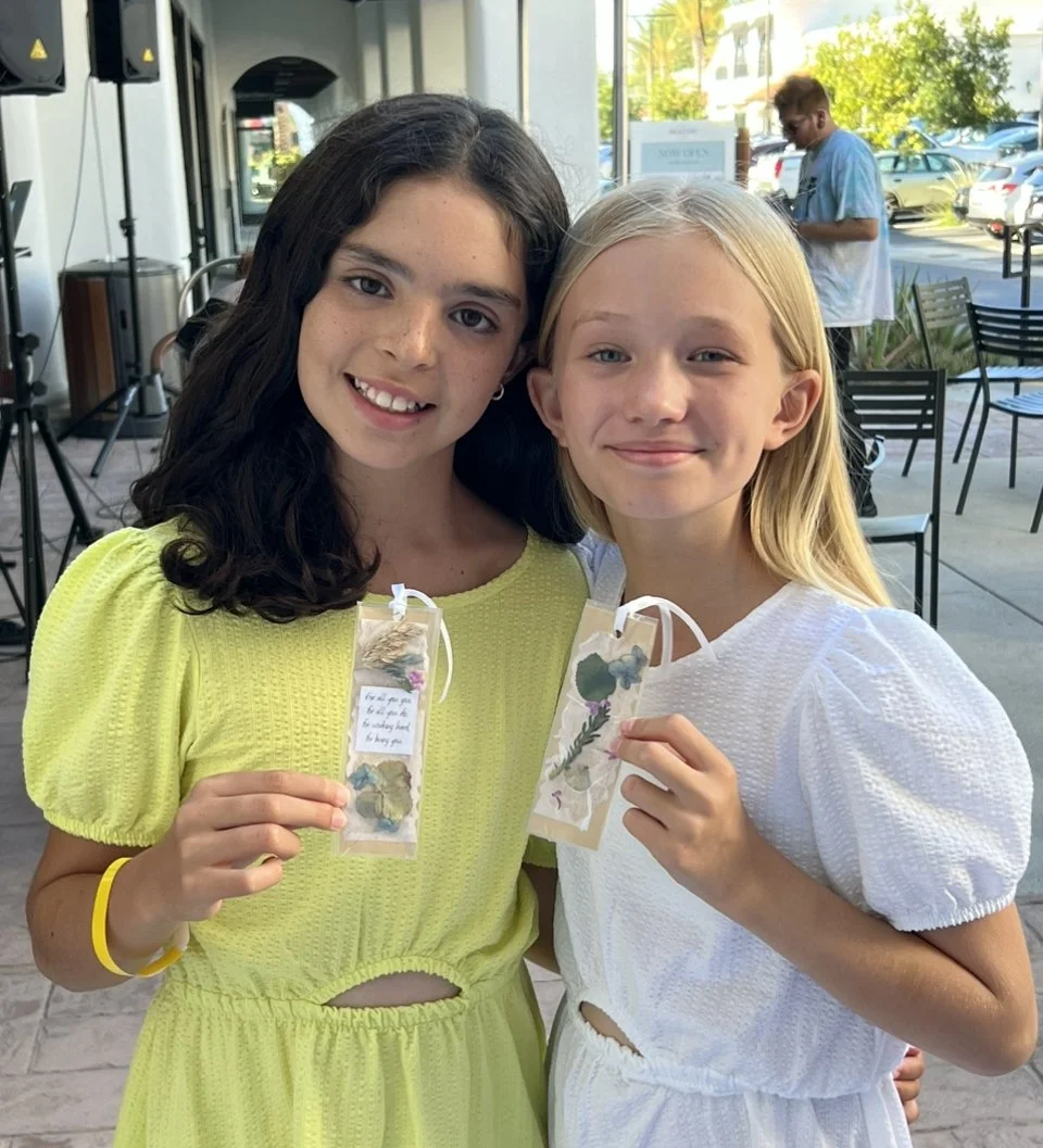 girls with bookmark.jpeg