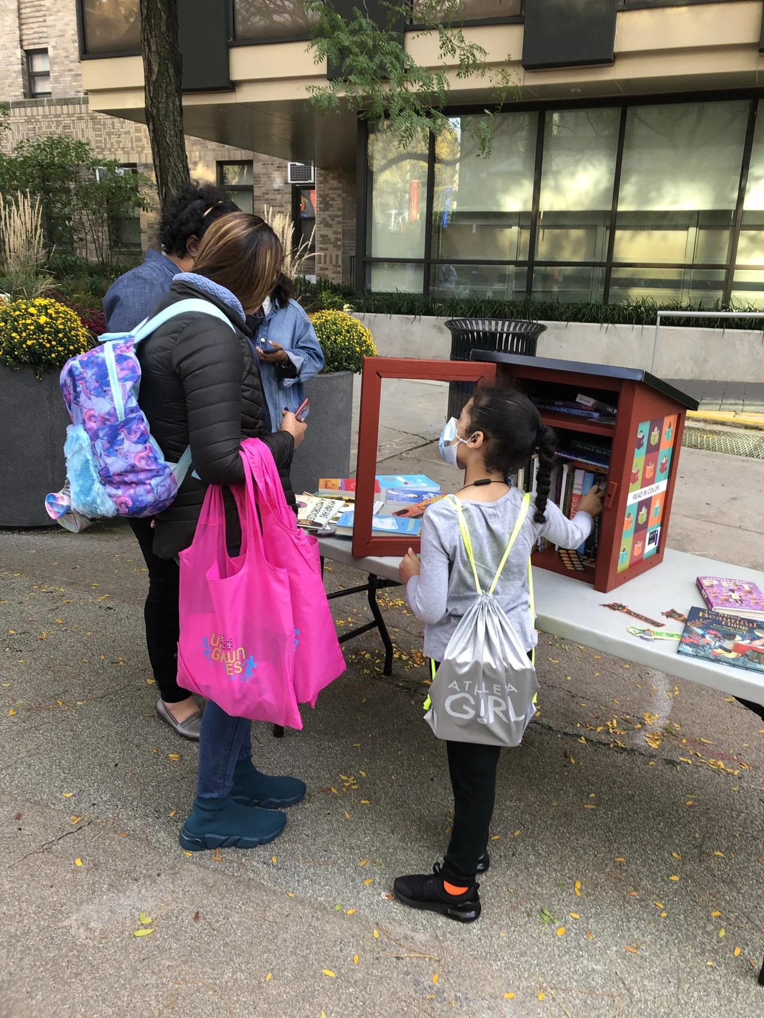 mom and daugher getting books.JPEG