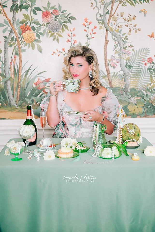 Branding, Magazine Photography, Headshot for Jewelry Store owner blonde hair, sipping tea with jewelry draped all over table by Amanda J Designs Photography, Louisville, KY.