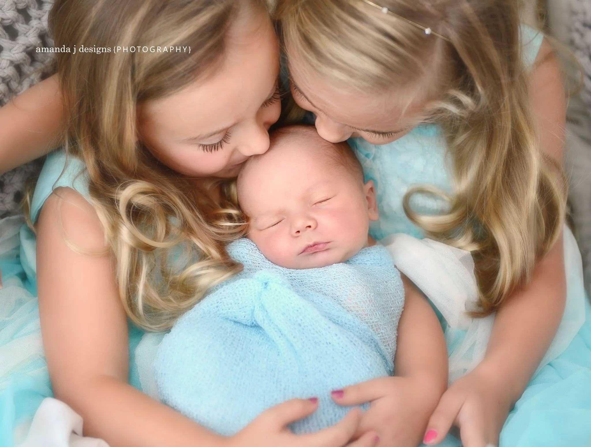 Newborn Sibling Photography, Baby Boy with sisters dressed in blue, Kiss by Amanda J Designs Photography, Louisville, KY