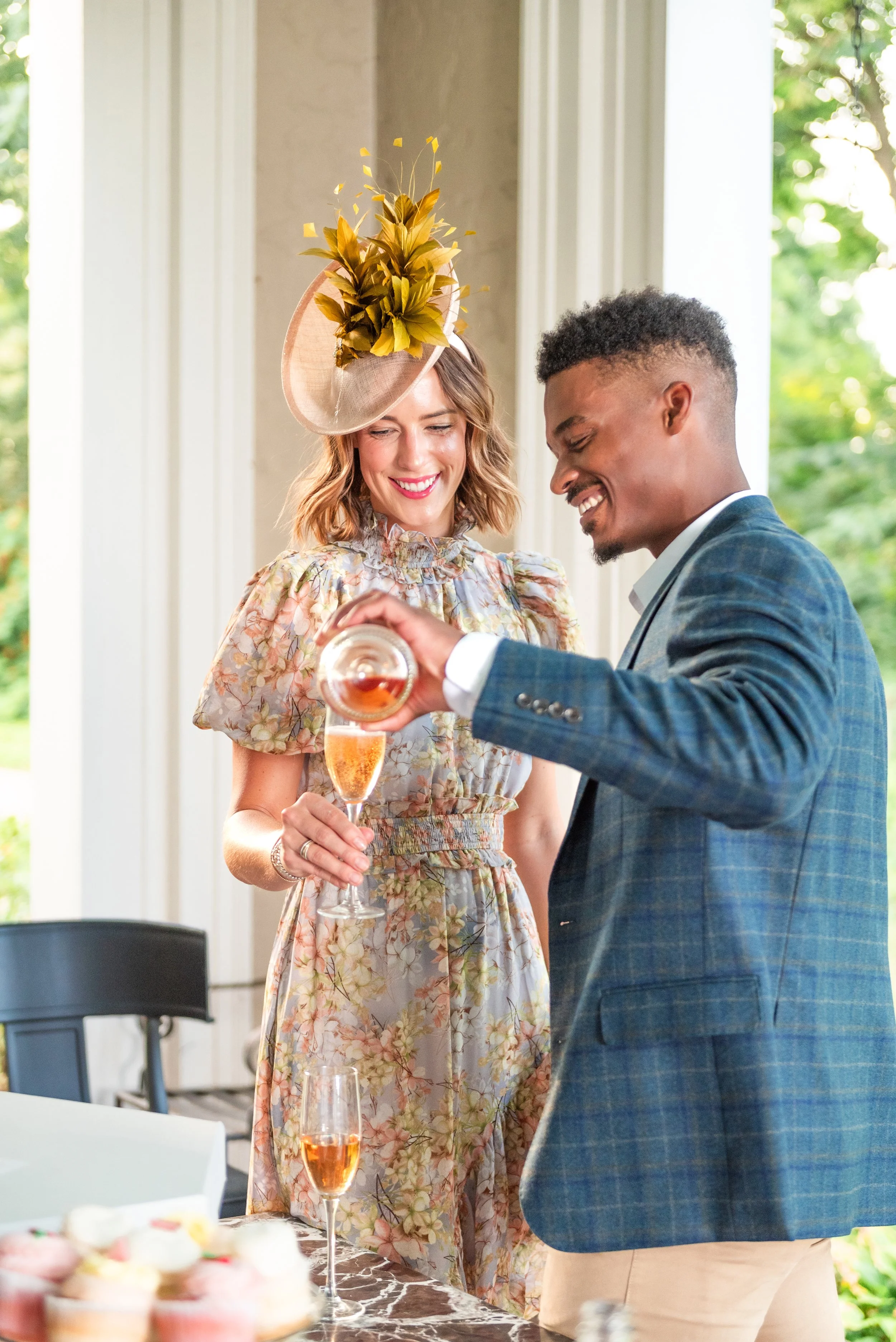 Branding Photoshoot for Kentucky Derby Attire, Man and woman enjoying a drink with custom fascinator by Amanda J Designs Photography in Louisville, KY . 