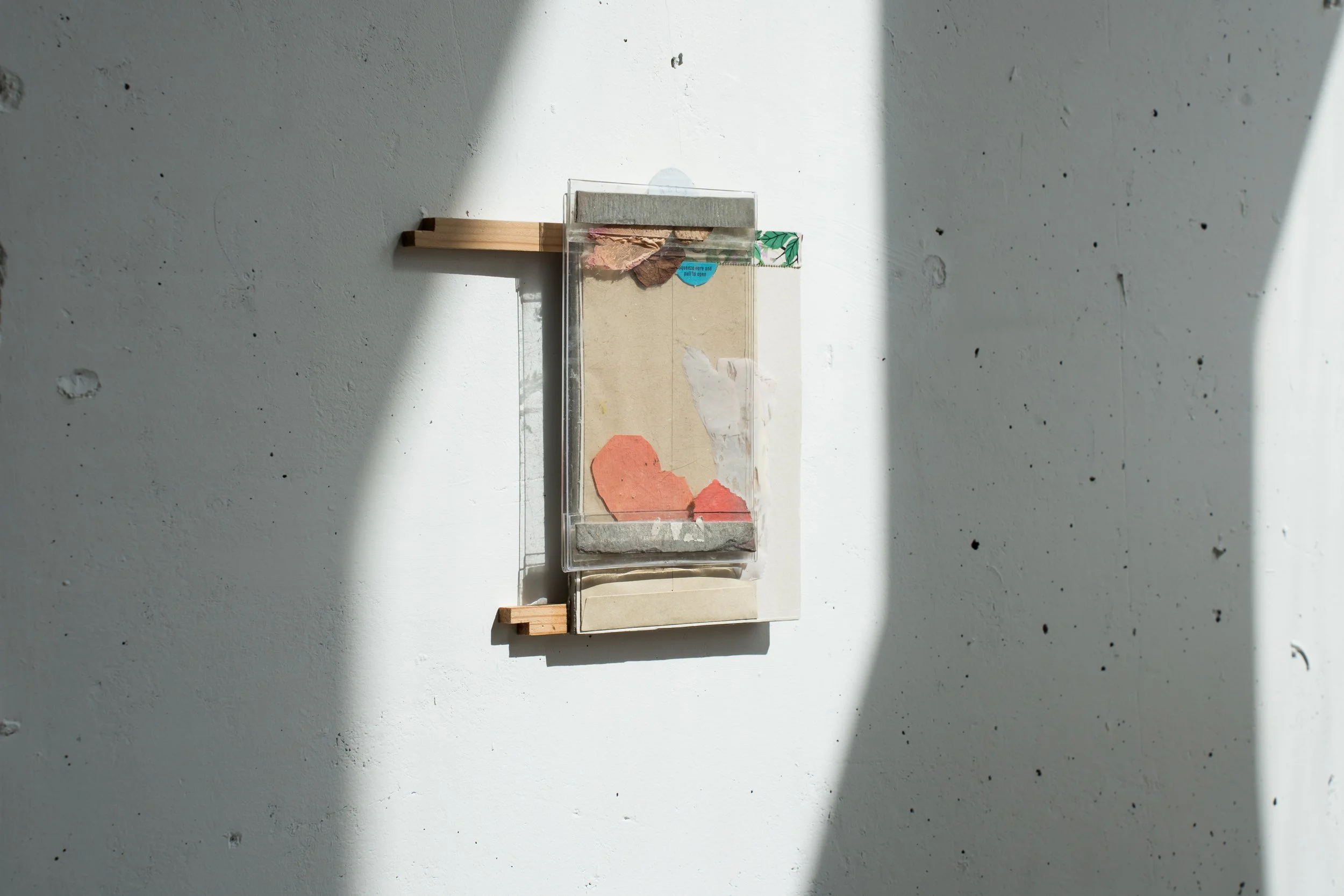 Balcony, 2025, oil, acrylic, masking tape, perspex, brown envelope, cardboard, plywood,
21 x 19.2cm | installed at Green on Red Gallery, Dublin. Photo by Maria McSweeney