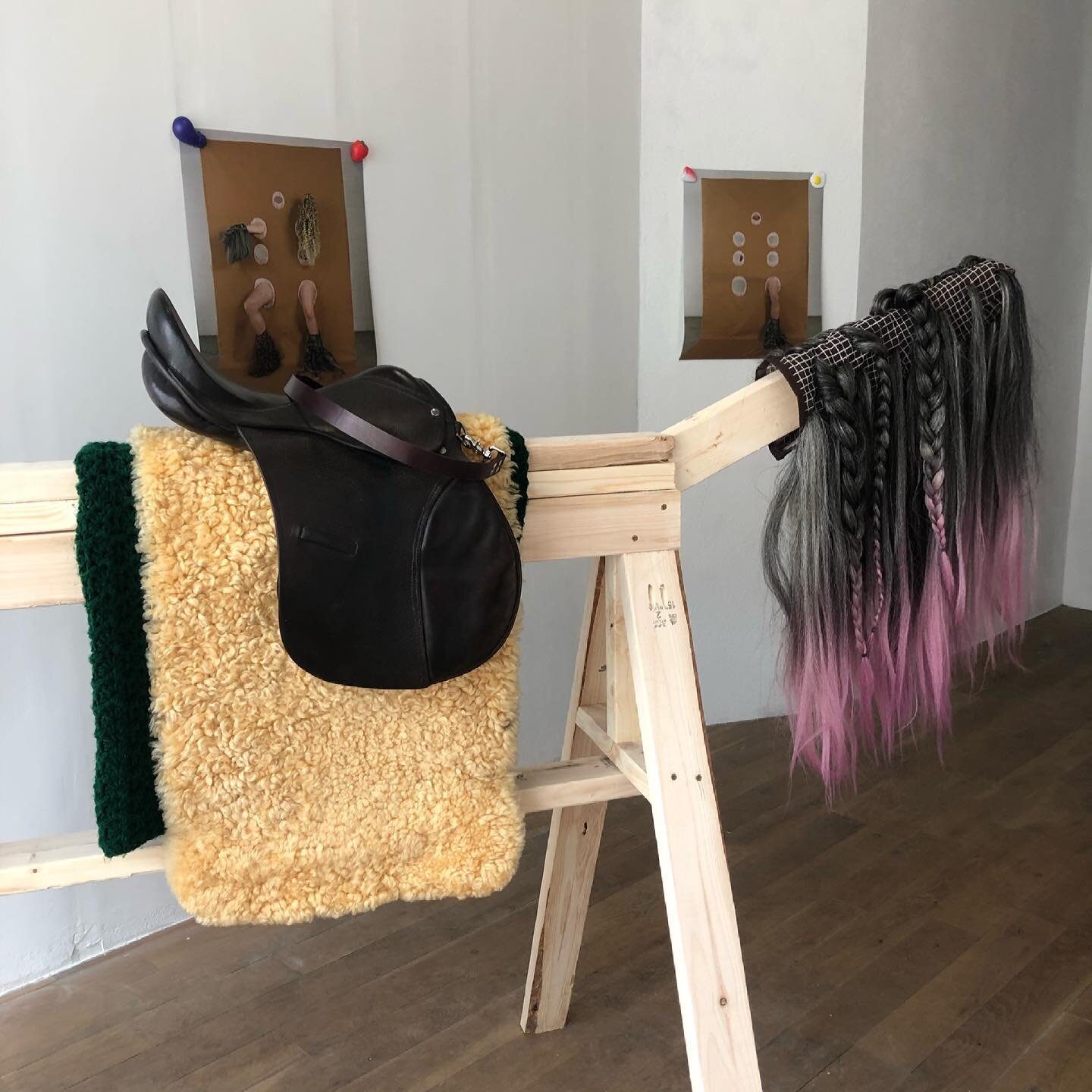 In SAW HORSES AND PONIES: A 21ST CENTURY TAIL, artist Mike Bourscheid turns masked interactions with  adorned, coiffed gloves into an ontological study. Reflecting on his own individuality vis-&agrave;-vis the other, and &mdash; via the  gloves-turne