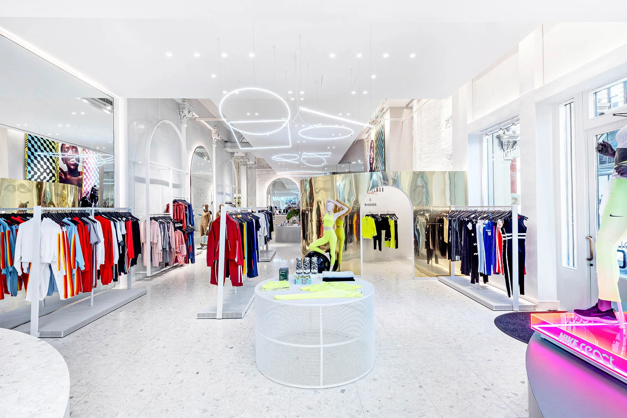 Bandier interior with unique lighting metal displays