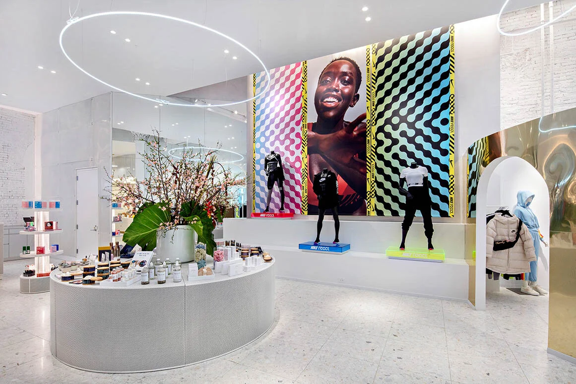 Large circular lighting, product display and colorful branding wall
