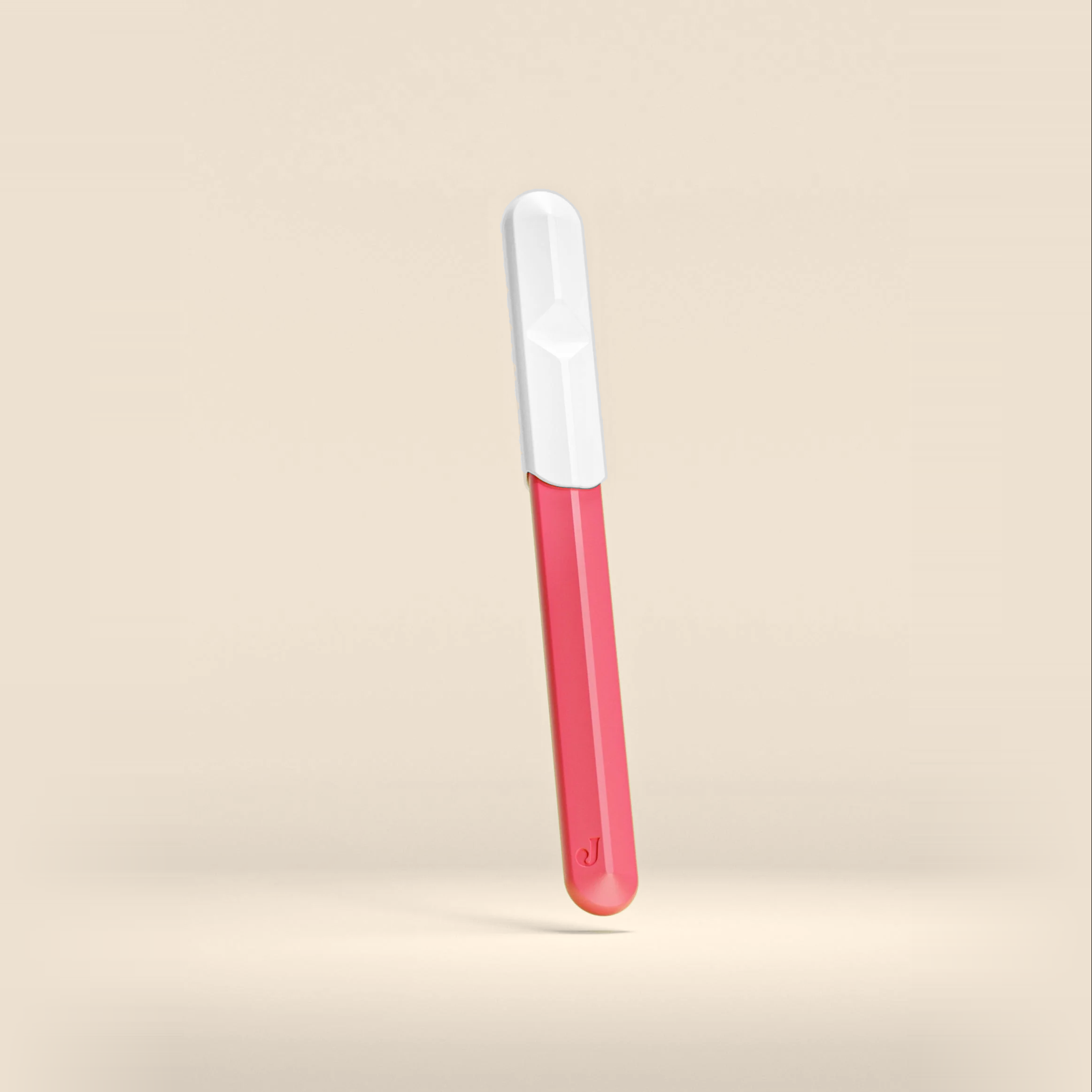 Jill Razor Pro dermaplaning razor in pink with weighted handle and white protective cap, designed for at-home facial skincare