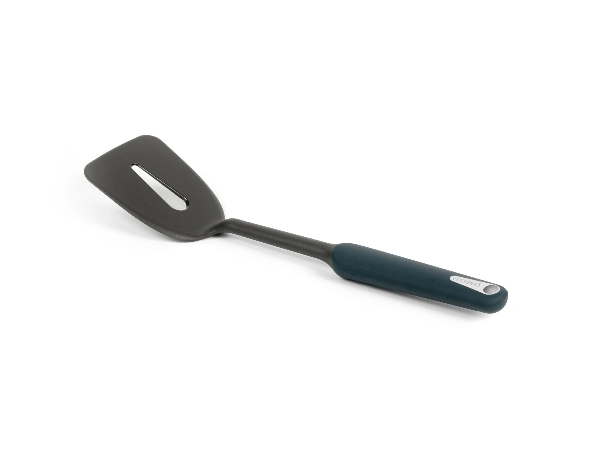 Single Cookduo Steelcore slotted nylon turner spatula at a 3/4 angle on white, showing the slim profile and navy TPR overmolded handle
