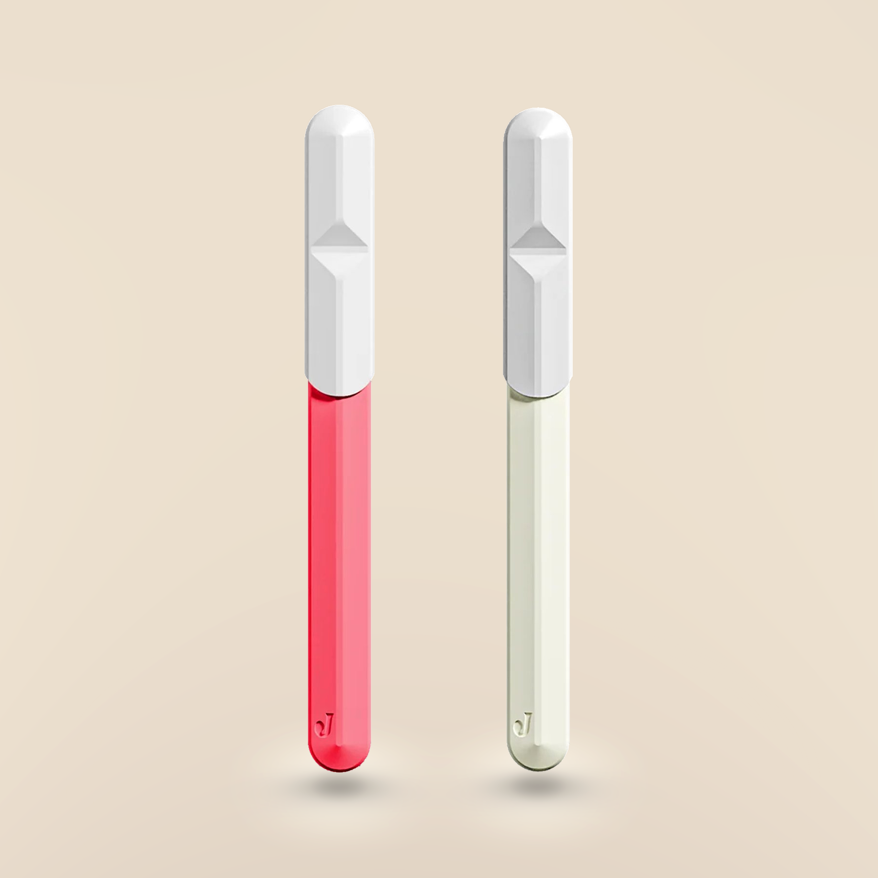 Jill Razor Pro dermaplaning razor shown in pink and cream colorways with white protective caps, premium at-home skincare tool