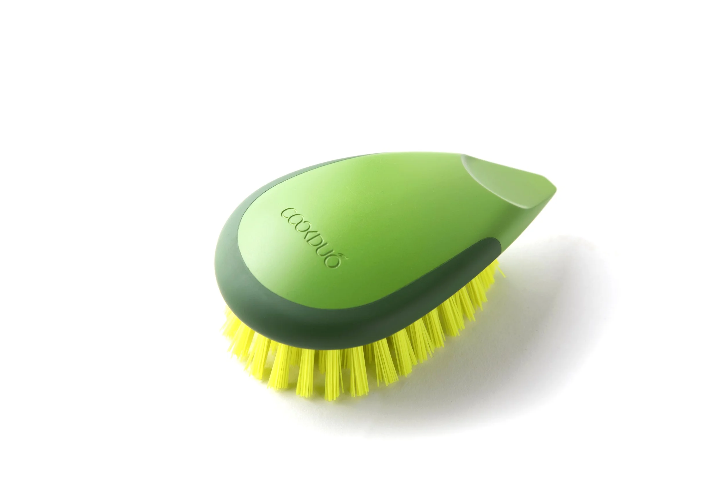 Cookduo Avocado Brush and Scrape, an avocado-shaped cleaning brush with an integrated scraper for removing stems and produce stickers