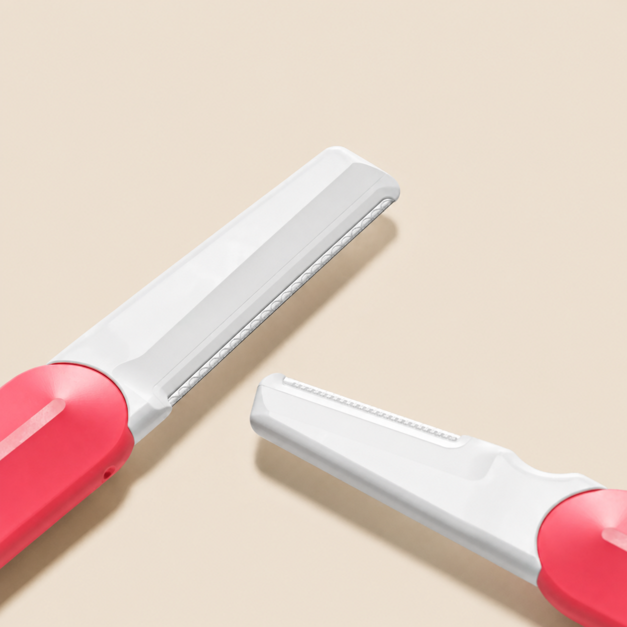 Detail close-up of Jill Razor Pro interchangeable dermaplaning blades, designed for different skin sensitivities and shaving preferences
