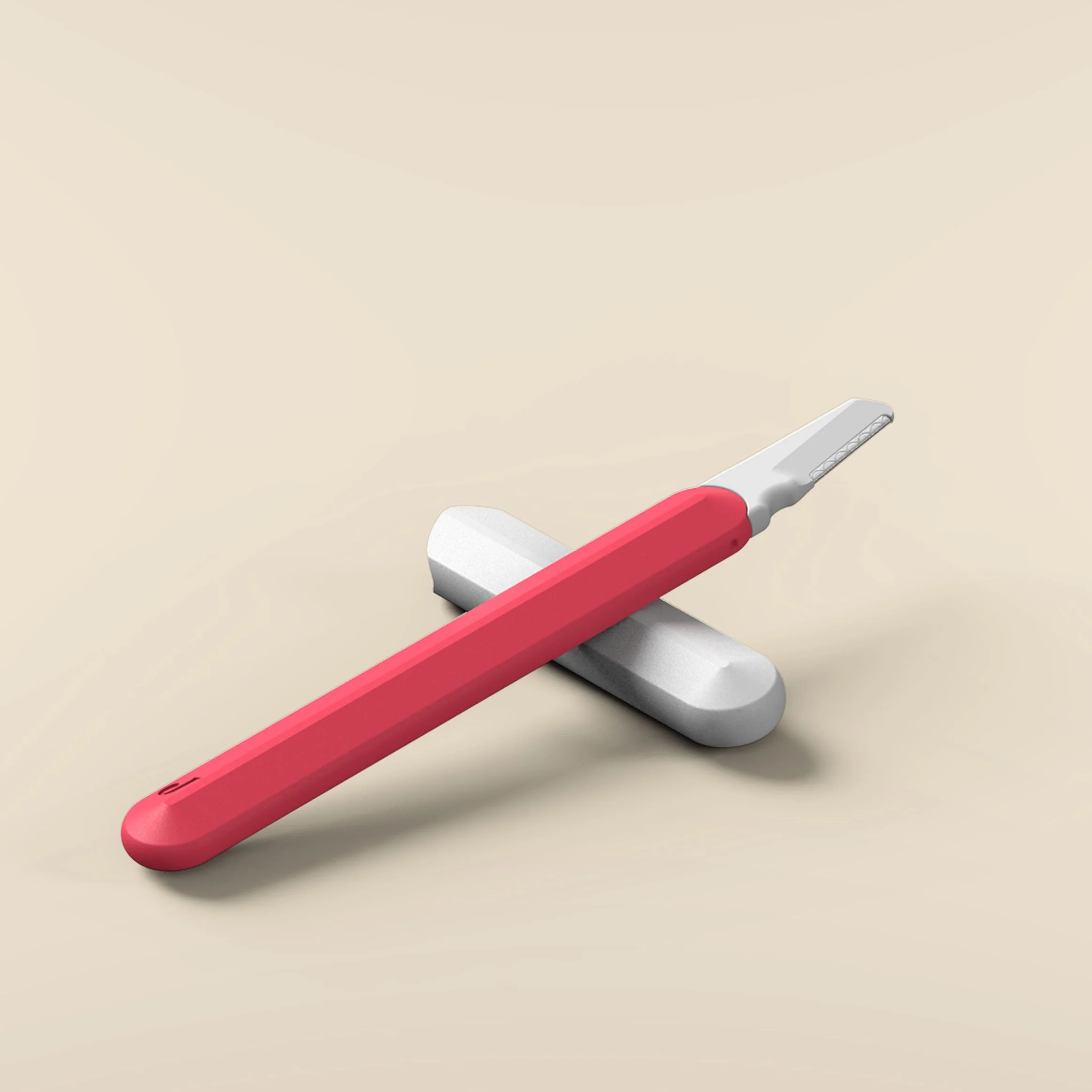 Jill Razor Pro from a 3/4 angle showing the exposed dermaplaning blade with the protective cap below acting as a resting stand to keep the blade elevated
