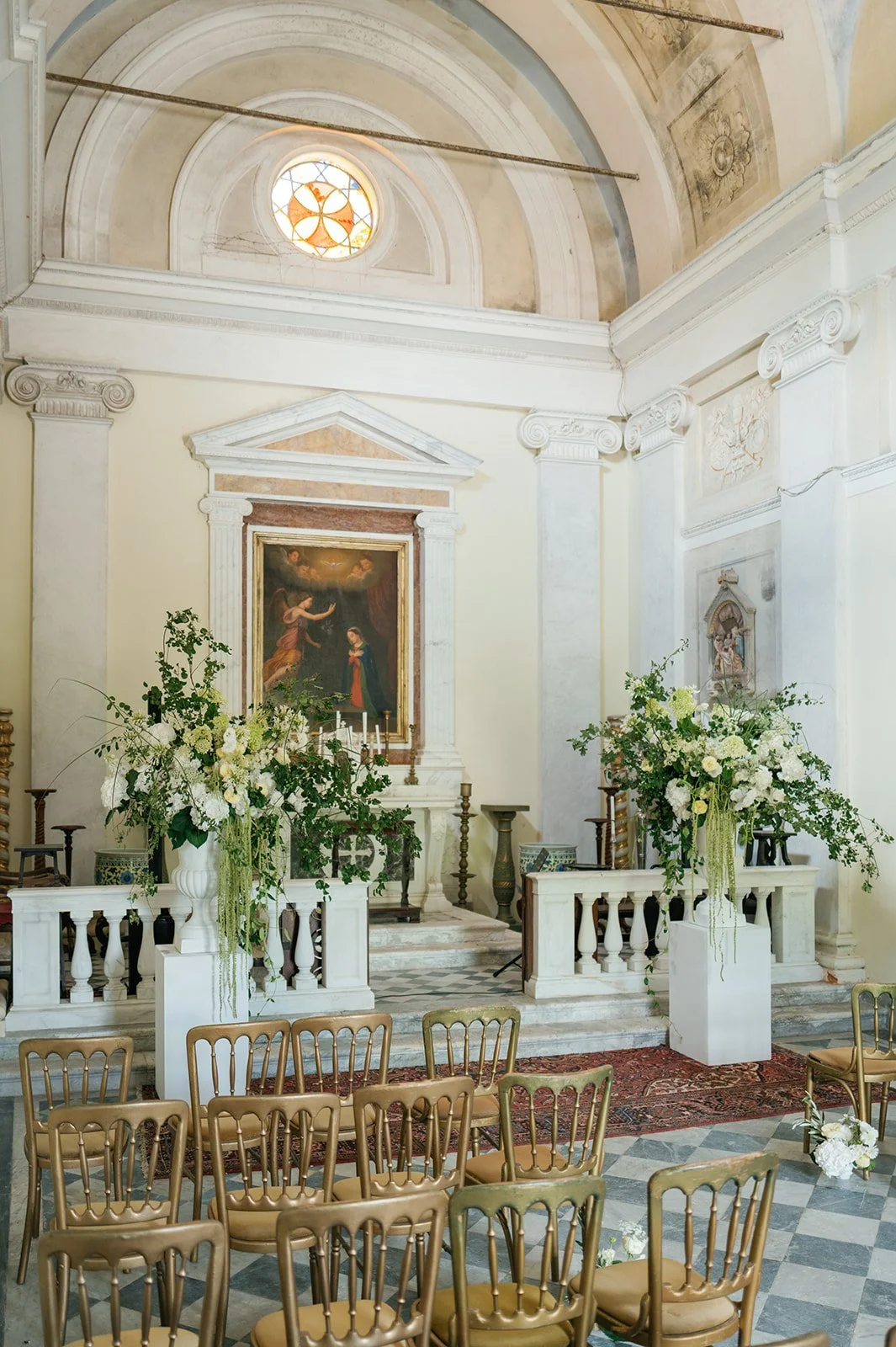 The Oratorio dell’Annunziata Chapel for wedding ceremony at Villa Michaela with green and white florals