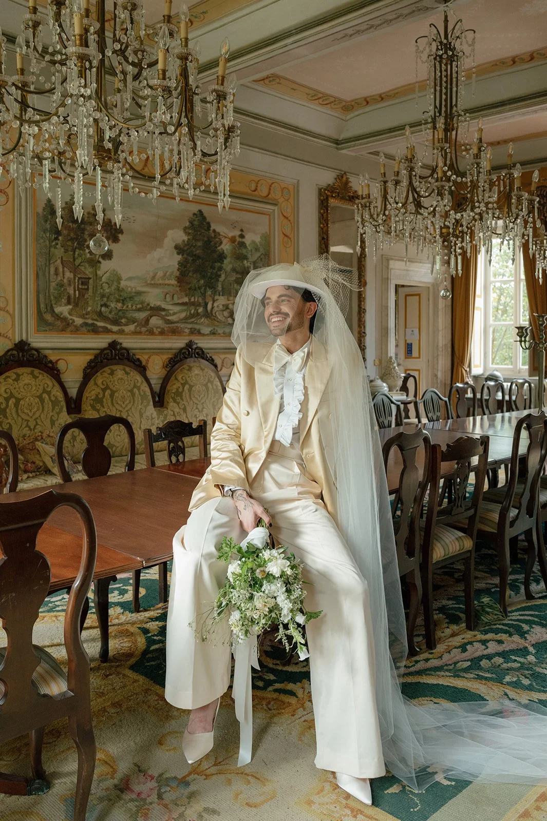 Dining room portrait at Villa Michaela, groom wearing vintage Vera Wang