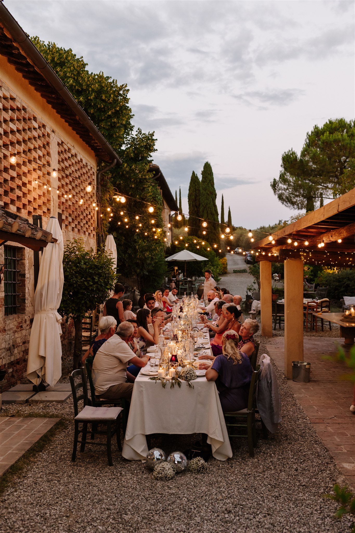 Wedding dinner with fairylights at Il Grand Prato, Tuscany, Italy