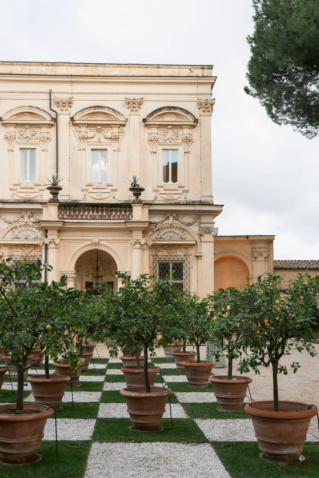 Geometric checkerboard lawn at Villa Aurelia, a classic Italian villa wedding venue in Rome.