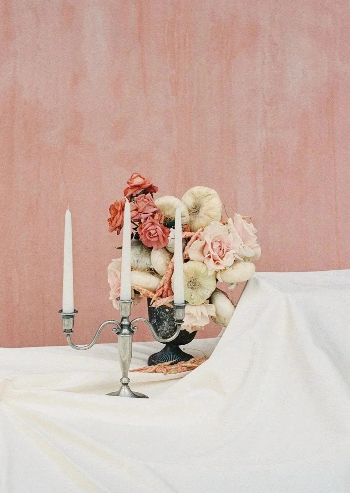 Pink and white florals and candelabras at aperitif at Tonnara di Scopello